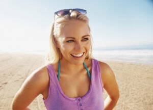 Woman on beach with sunglasses